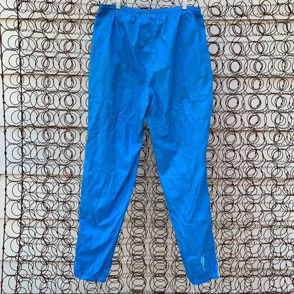 Vintage Nike blue windbreaker track pants zipper ankle pockets drawstring